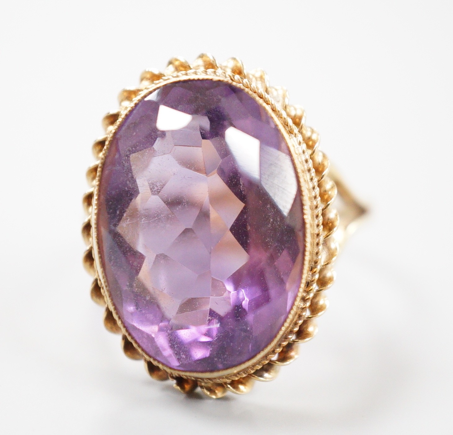 A 1970's 9ct gold and amethyst set dress ring, size O/P gross weight 6.1 grams.